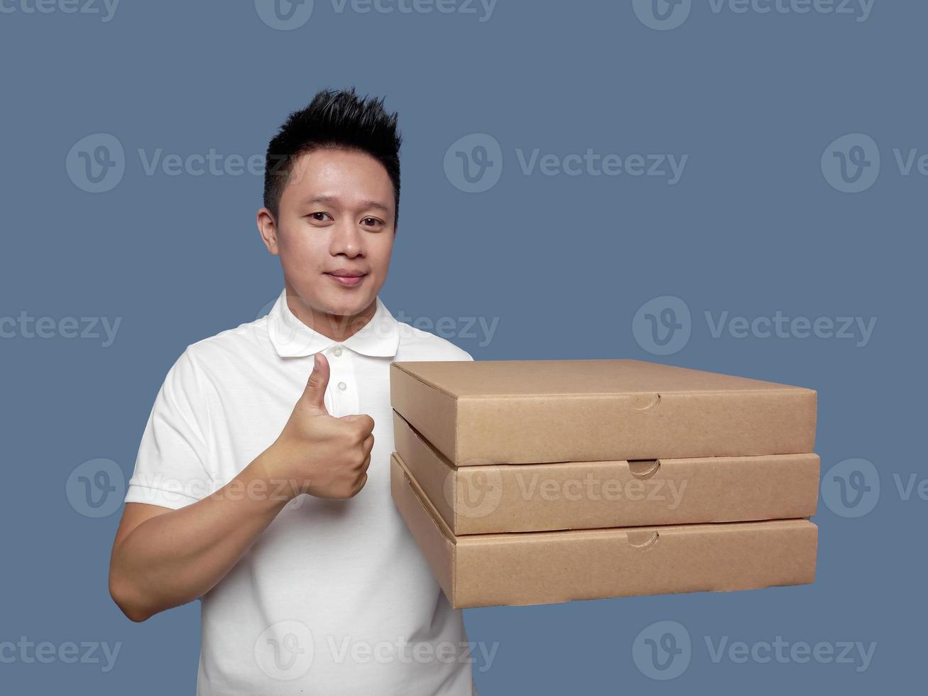 Man holding cardboard box with thumbs up gesture photo