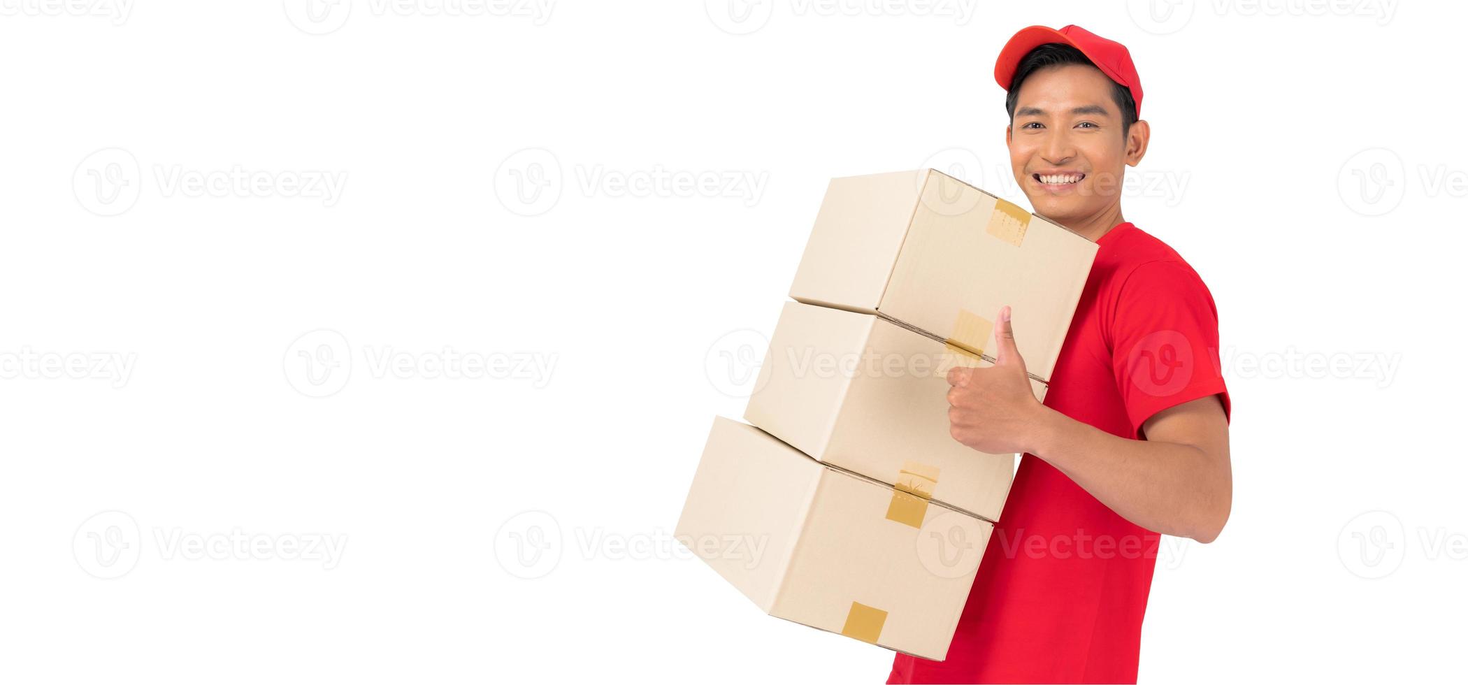 The smiling delivery man is dressed in a red cap and blank t-shirt uniform, and is standing in front of a white background photo