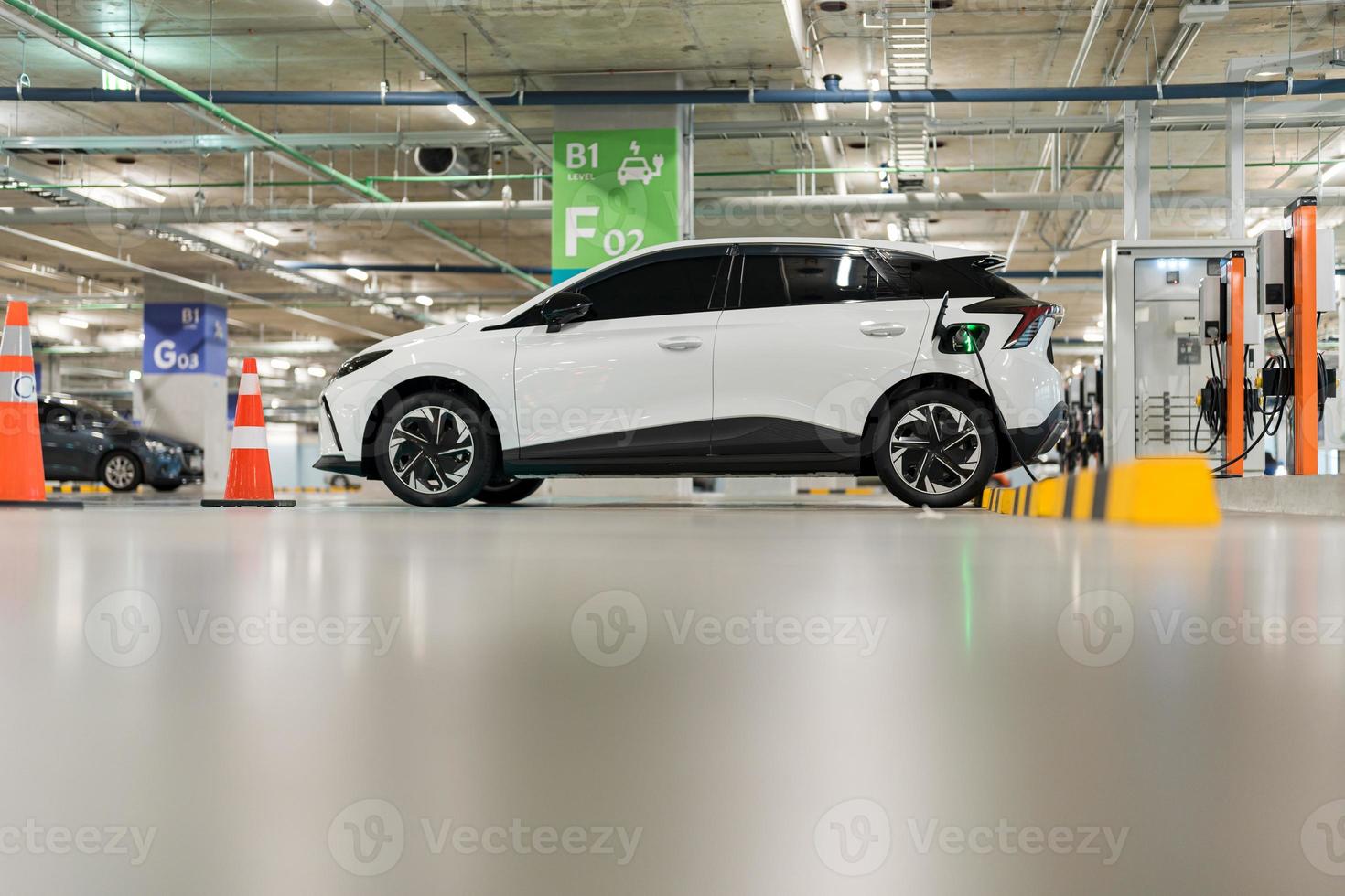 Charging of electric cars at a charging station, automotive industry, transportation photo