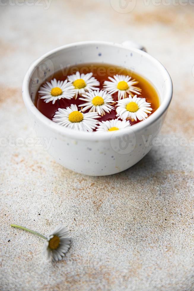 tea chamomile flowers healing hot drink healthy meal food snack on the table copy space food background rustic top view photo