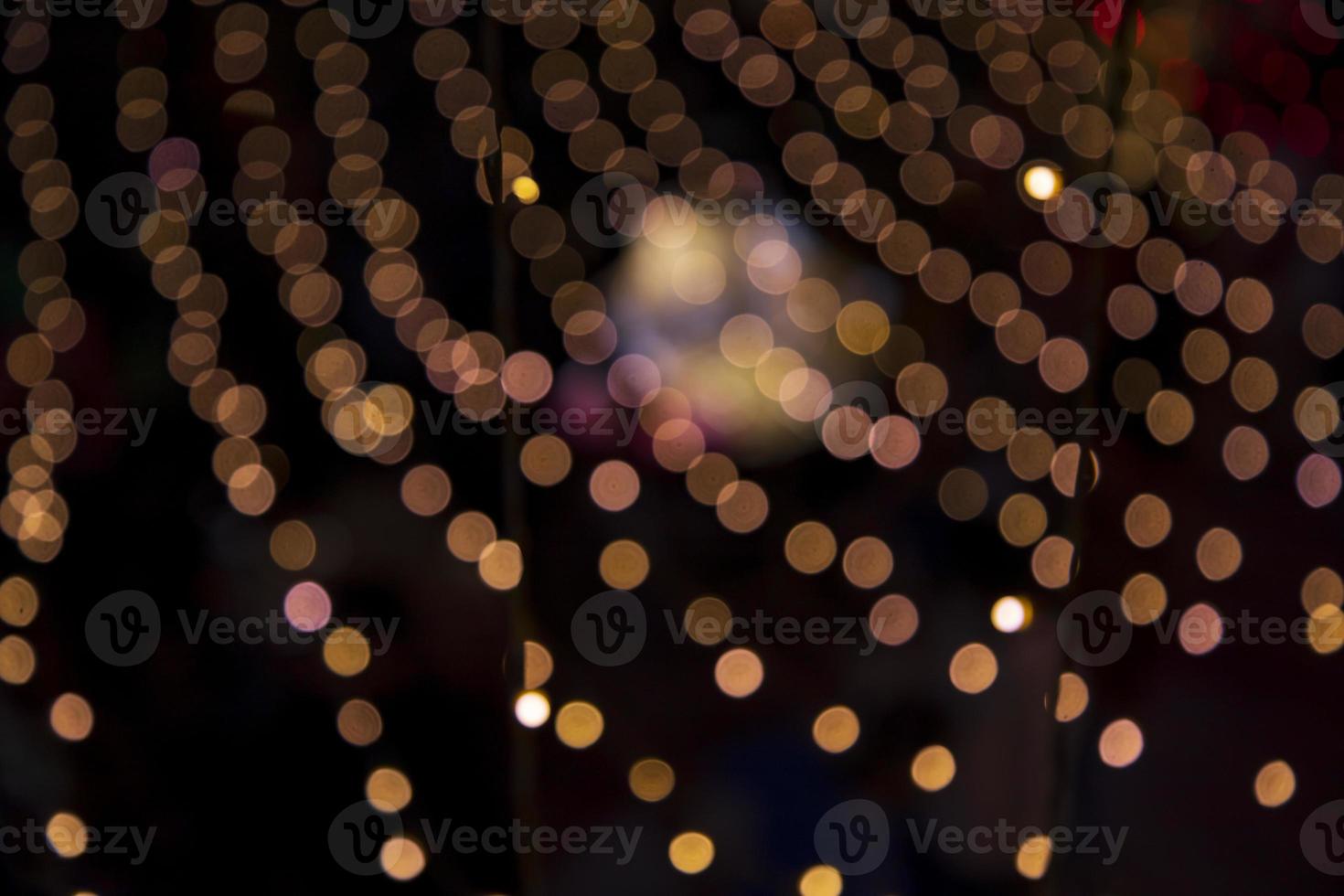 Colorful Defocus Abstract bokeh light effects on the street night black background texture wallpaper photo