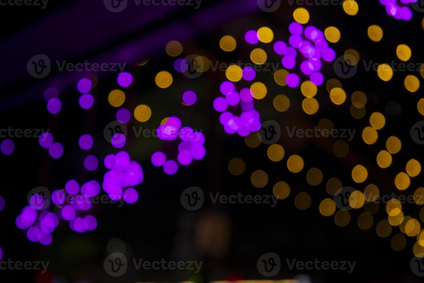 Colorful Defocus Abstract bokeh light effects on the street night black background texture wallpaper photo