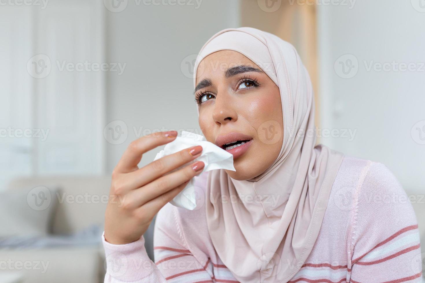 Depressed Muslim lady in hijab headscarf, sadness and frustration, crying woman, despair emotions expression The life of a woman in the Muslim world is doomed to live in fear and suffering. photo