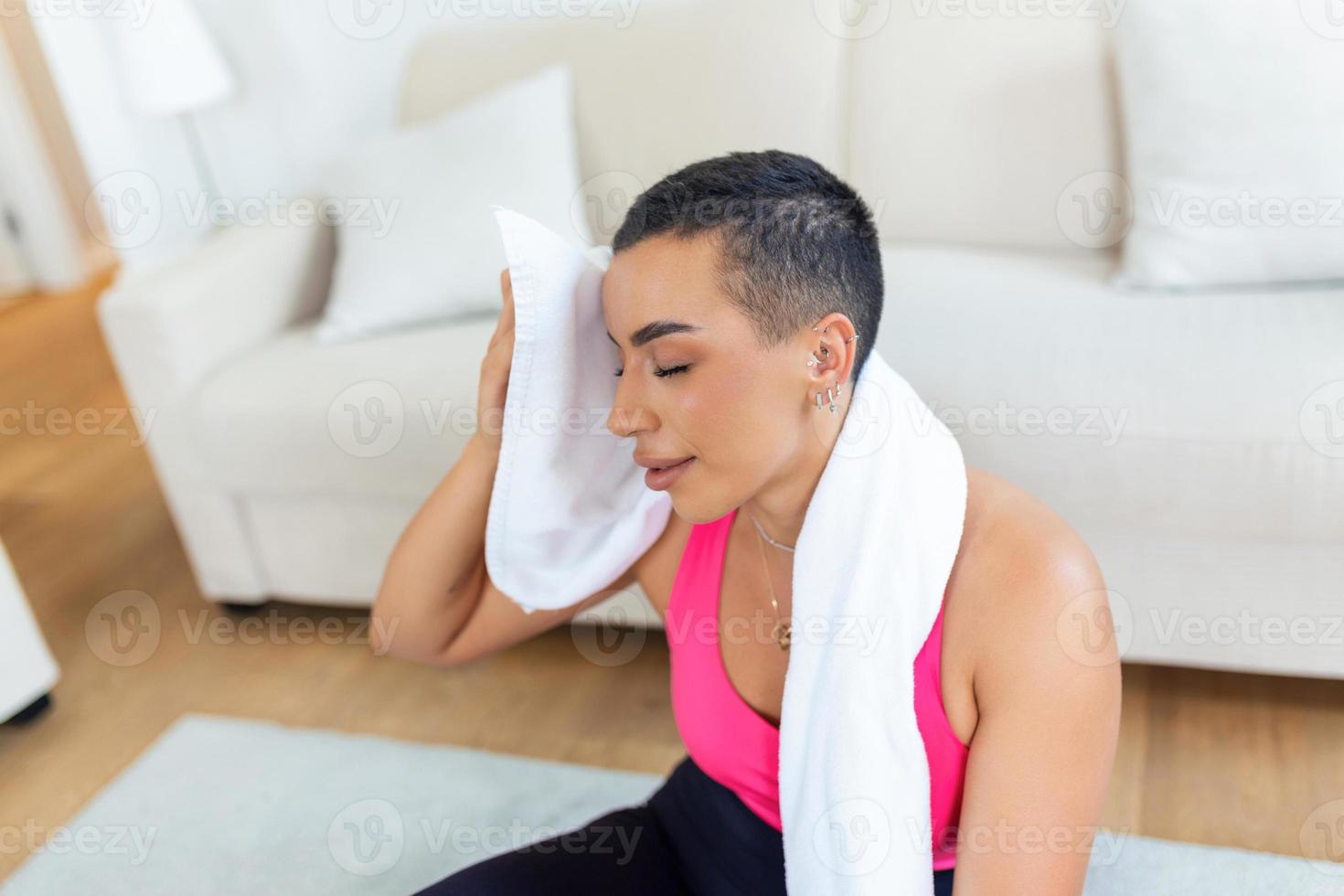 Fitness Model. Portrait of pretty smiling sporty black woman in sportswear having break after exercising with towel on her shoulders, looking away, free copy space photo