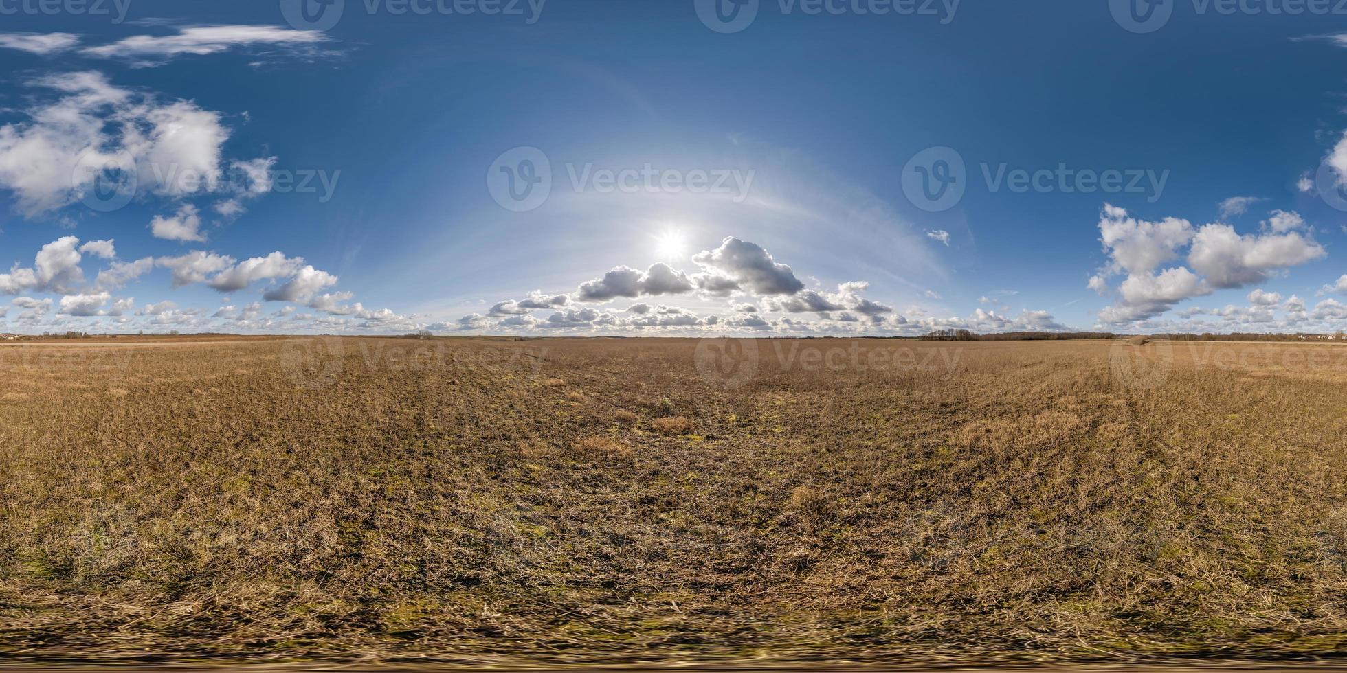 spherical 360 hdri panorama among farming field with clouds on blue sky in equirectangular seamless projection, use as sky replacement in drone panoramas, game development as sky dome or VR content photo