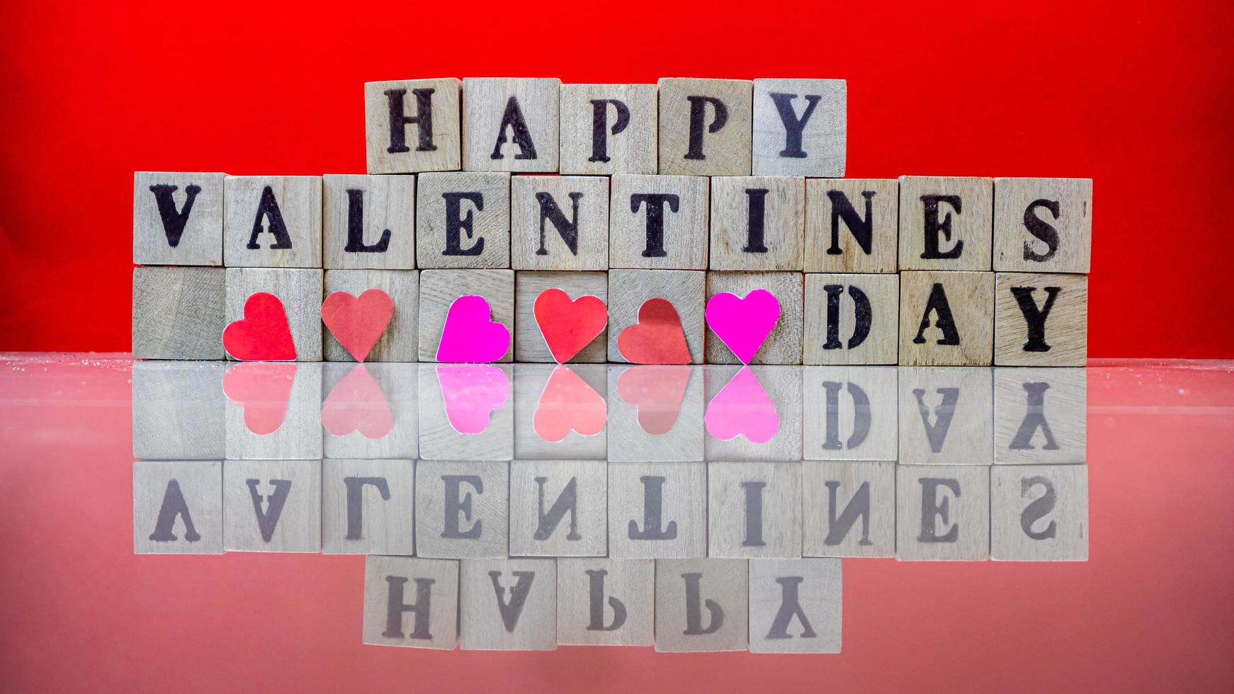 Happy valentine day on wooden blocks photo