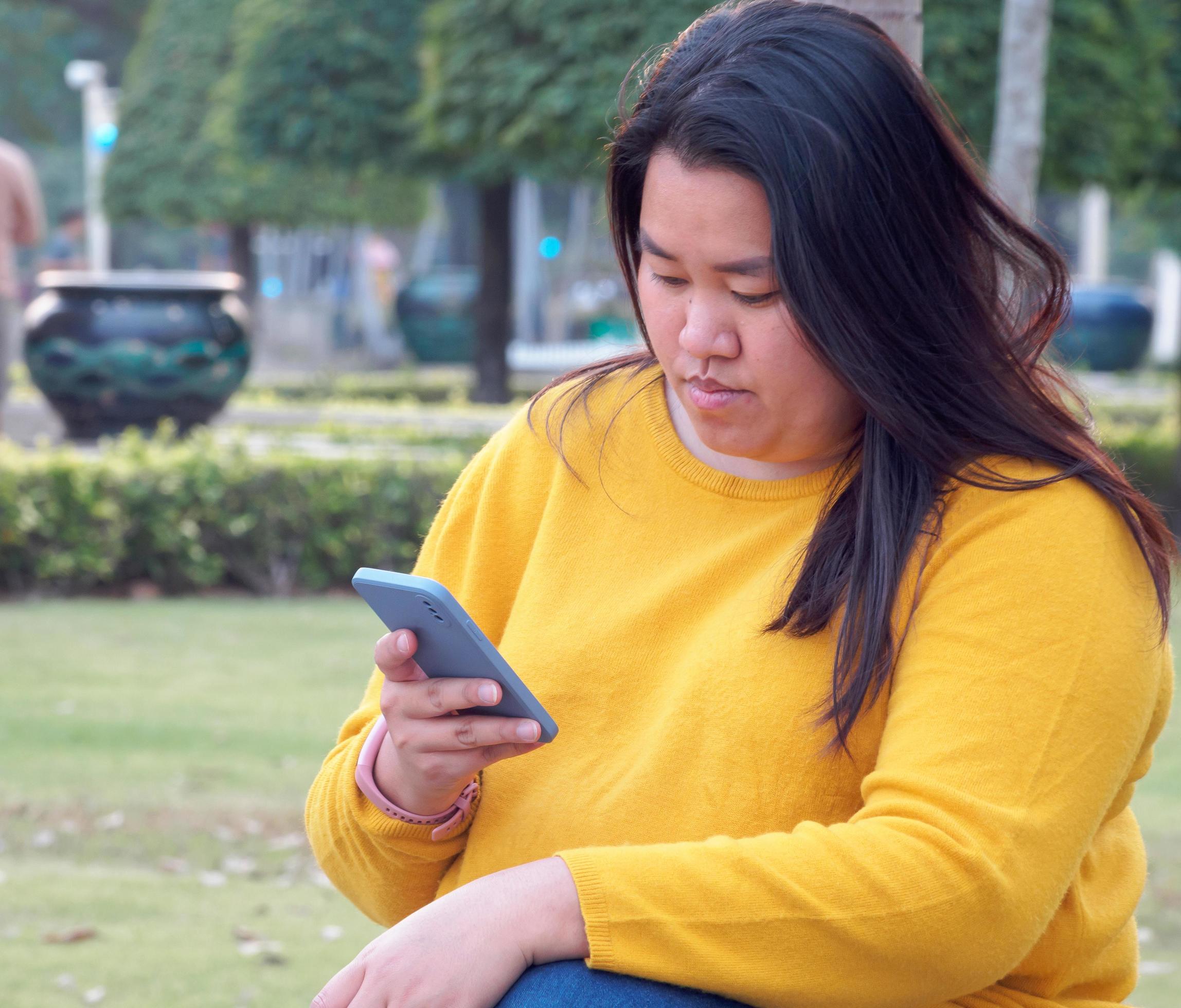 Portrait Fat Asian Woman Long Black Hair Wearing Yellow Shirt Are Using Mobile Phone Or 