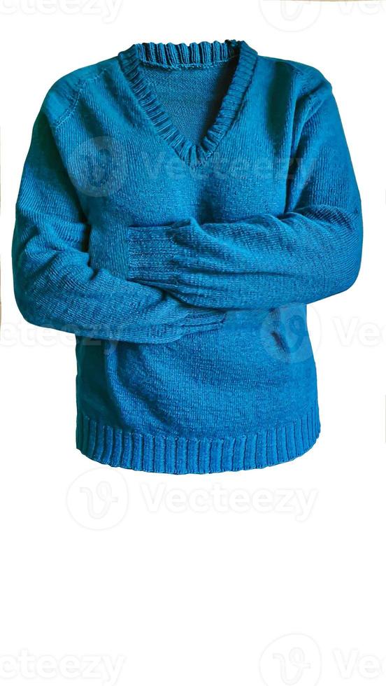 Knitted handmade products. Knitted fabric of colored threads in the color of petrol. Brown background. photo
