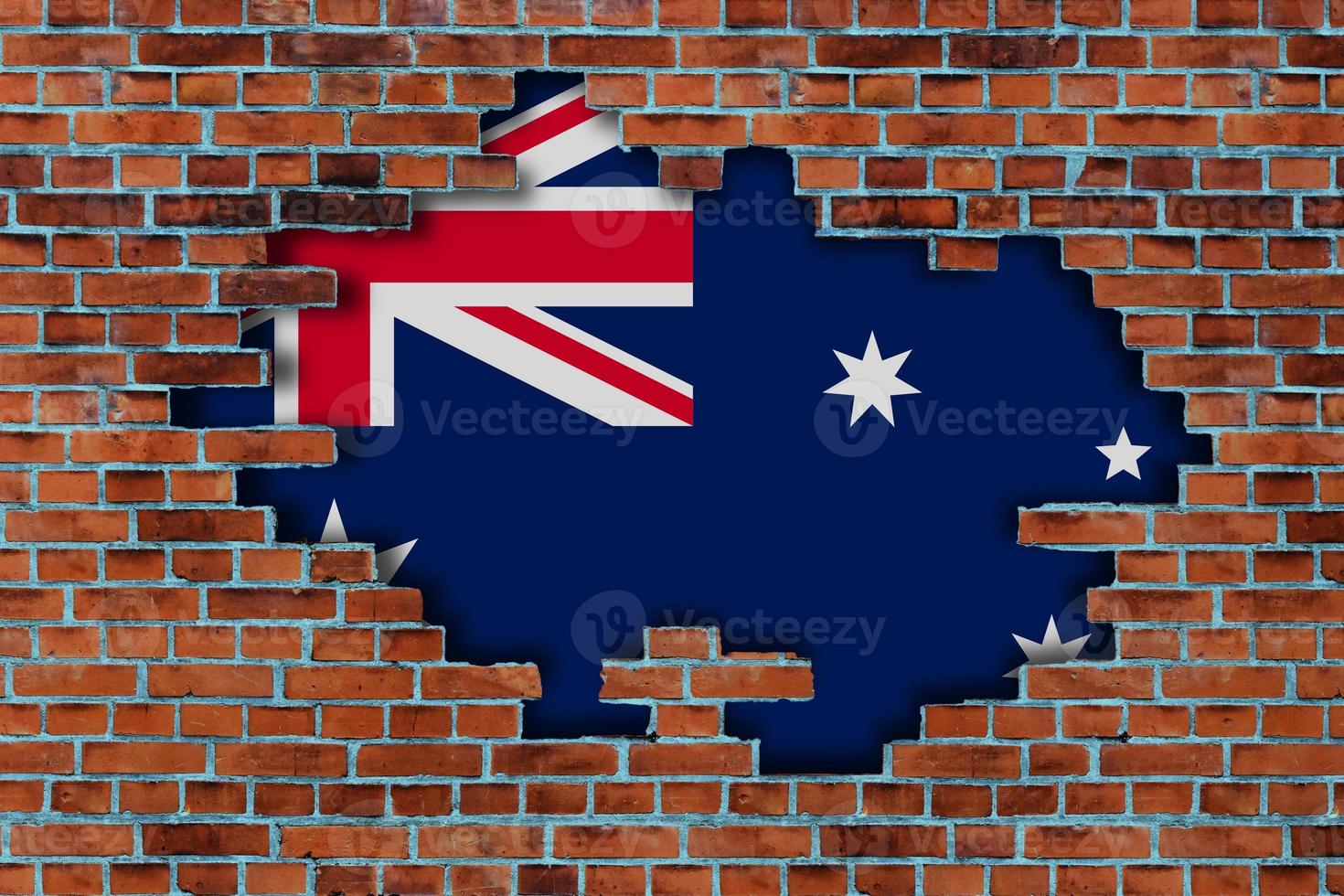 3D Flag of Australia behind the broken old stone wall background. photo