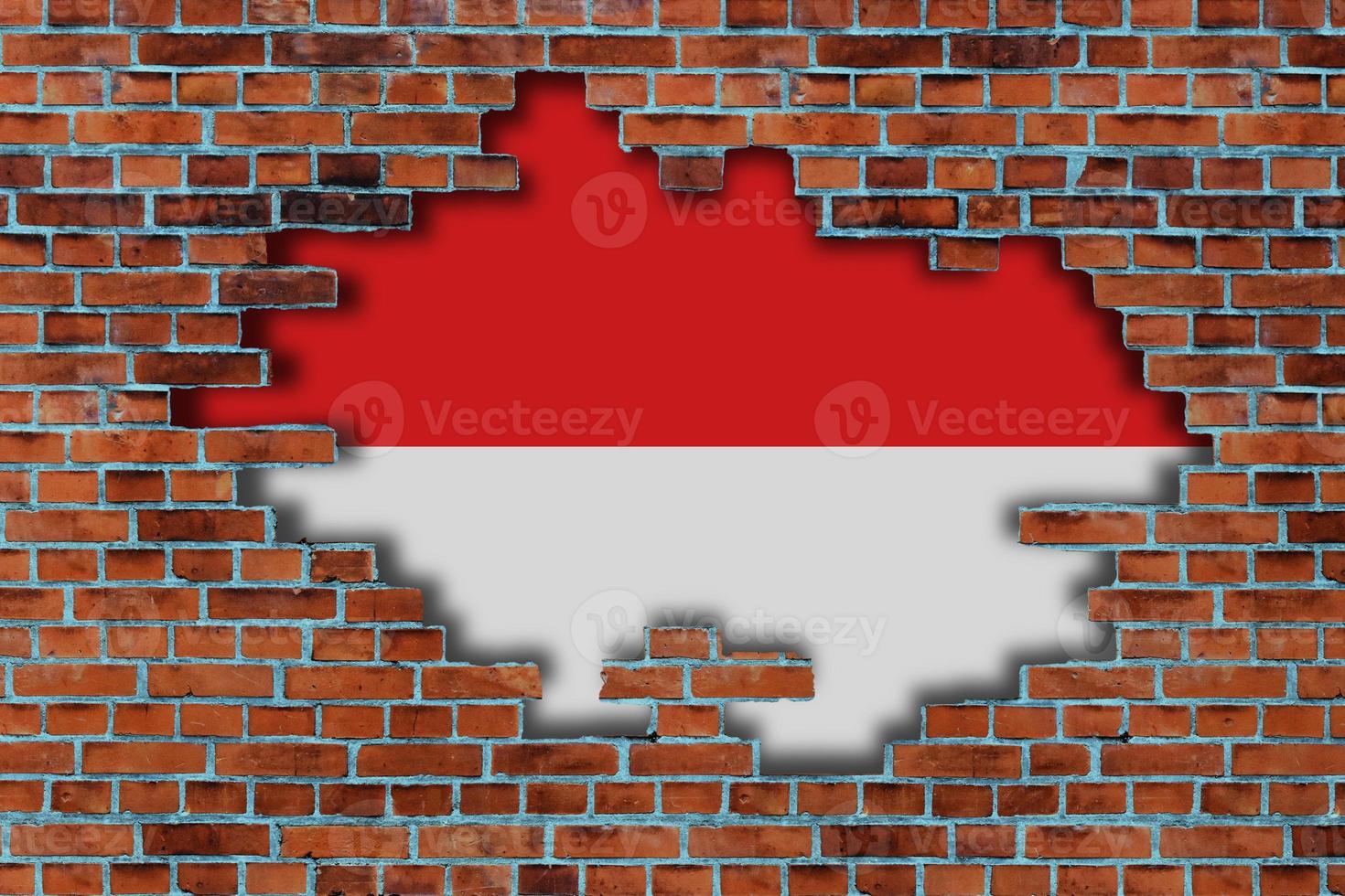 3D Flag of Indonesia behind the broken old stone wall background. photo