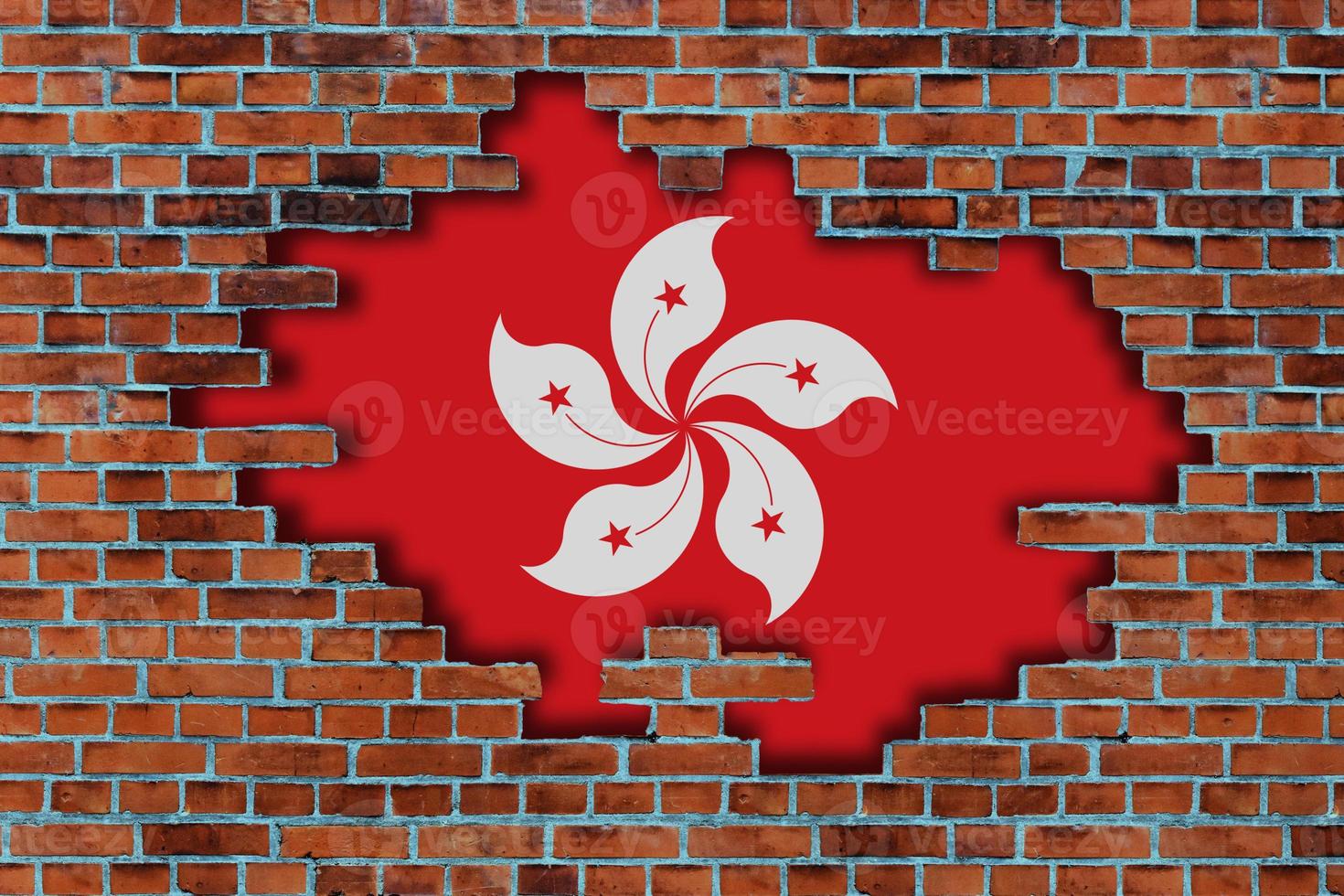 3D Flag of Hong Kong behind the broken old stone wall background. photo