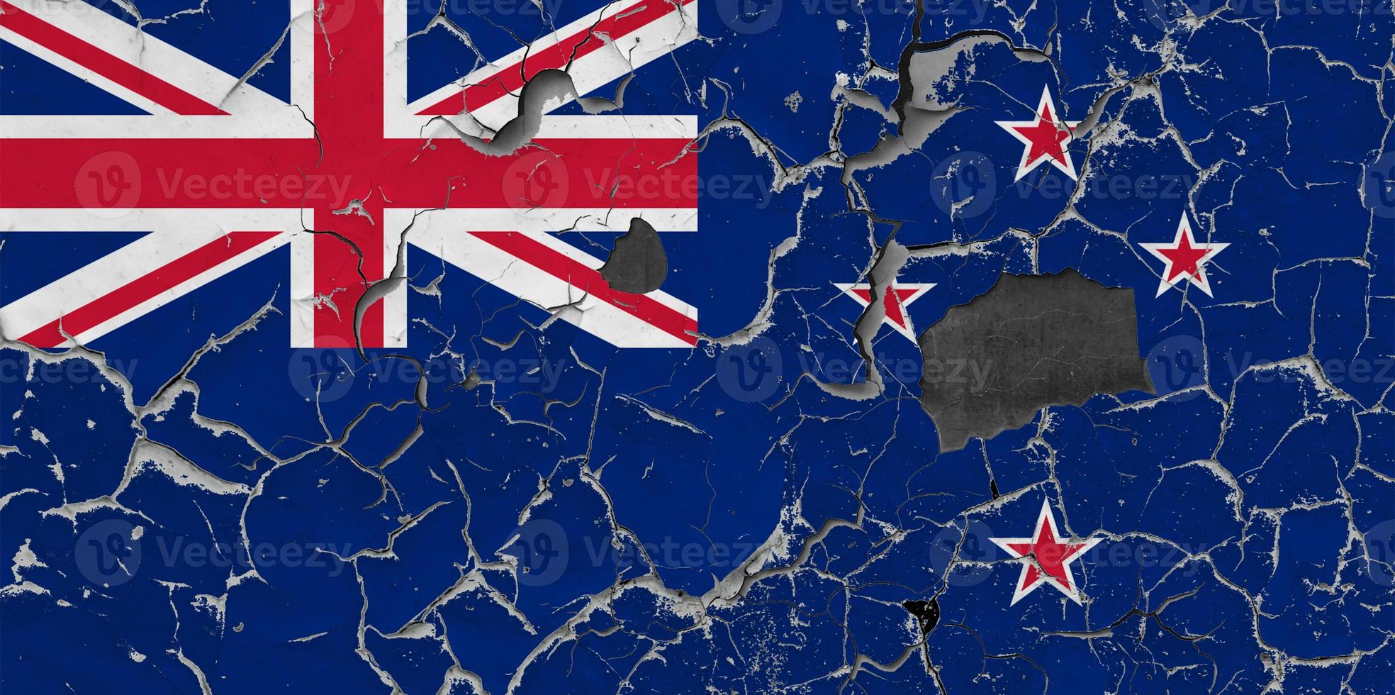 3D Flag of New Zealand on an old stone wall background. photo