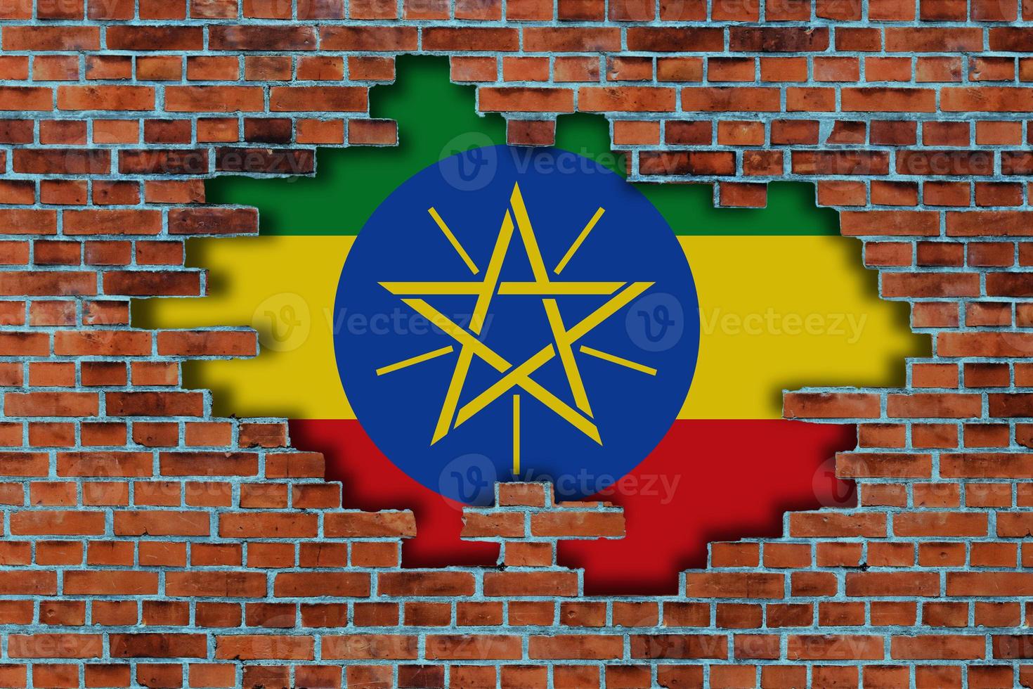 3D Flag of Ethiopia behind the broken old stone wall background. photo