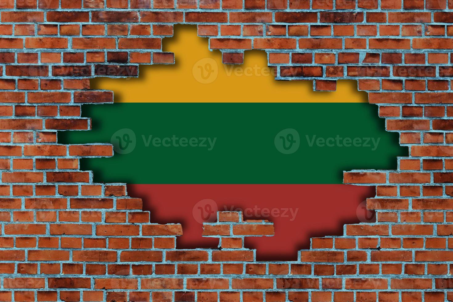 3D Flag of Lithuania behind the broken old stone wall background. photo