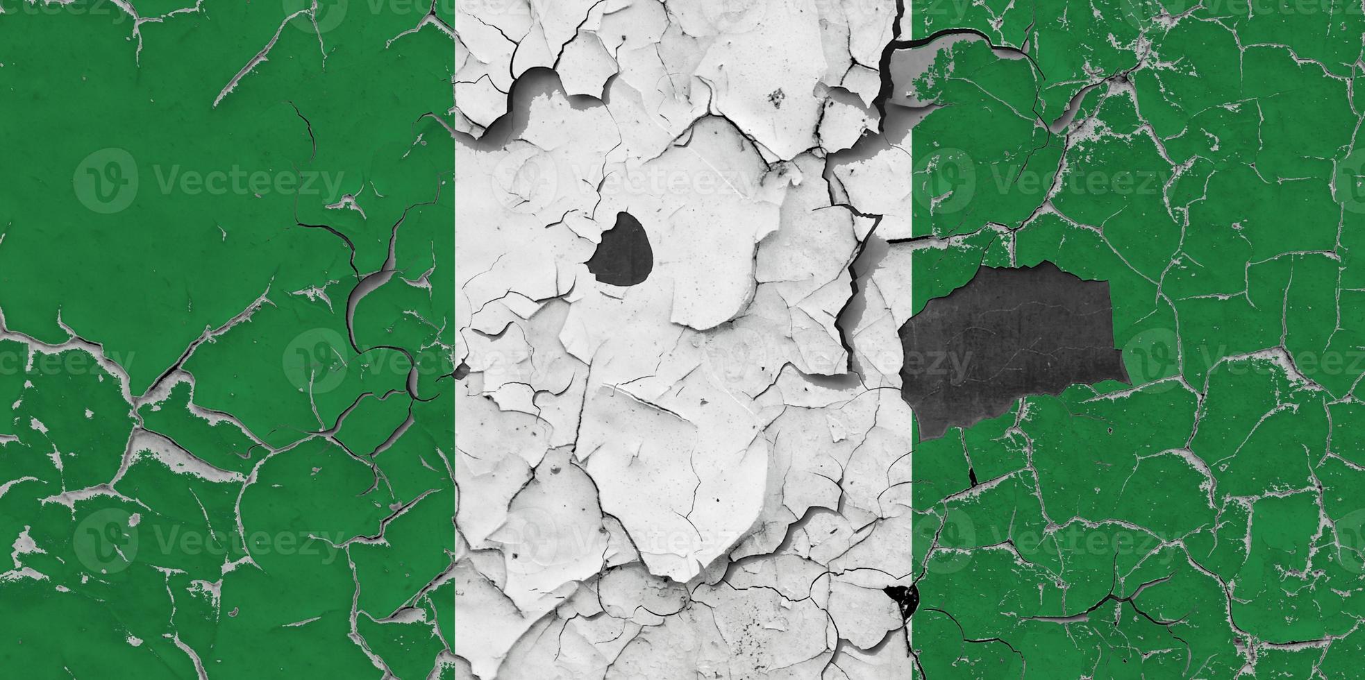 3D Flag of Nigeria on an old stone wall background. photo