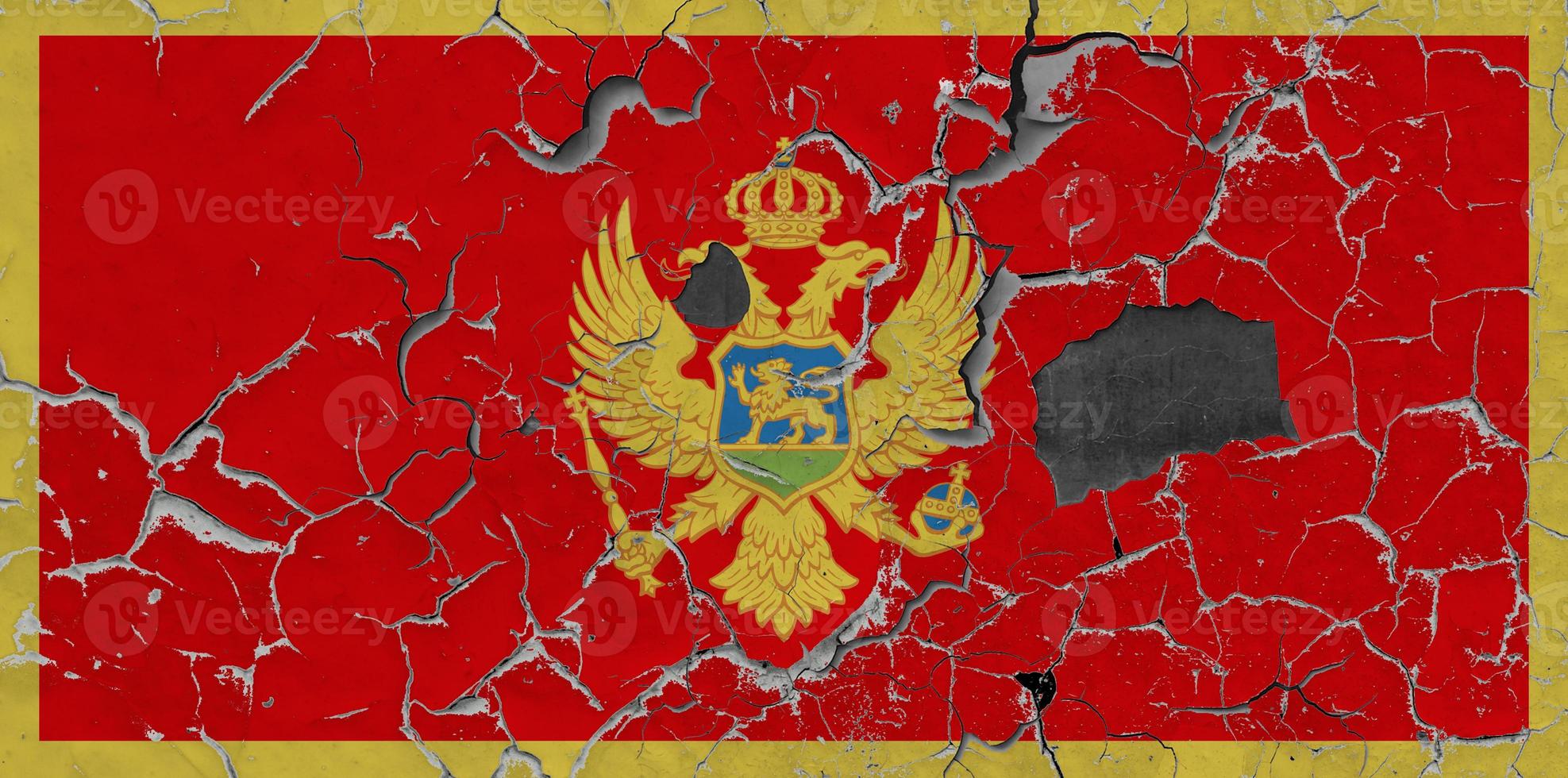 3D Flag of Montenegro on an old stone wall background. photo