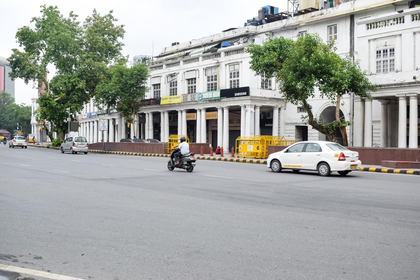 Delhi, India, March 31 2023 - Famous business district Connaught Place know as CP Delhi in the centre of New Delhi India with Offices, Banks and Shopping. British style architecture CP in Delhi, India photo