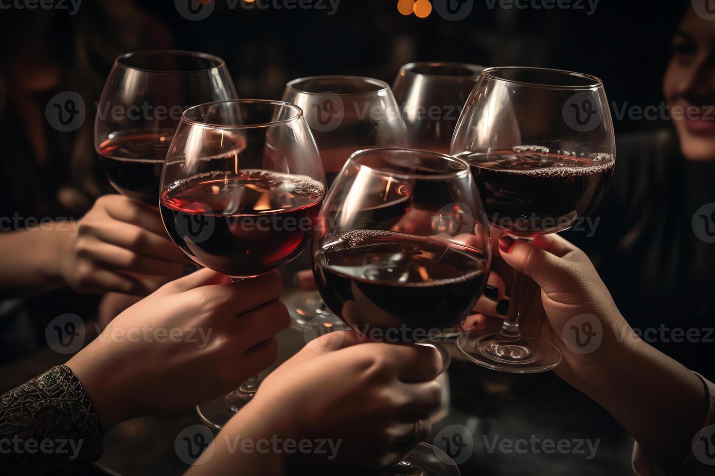 People holding glasses of wine. photo