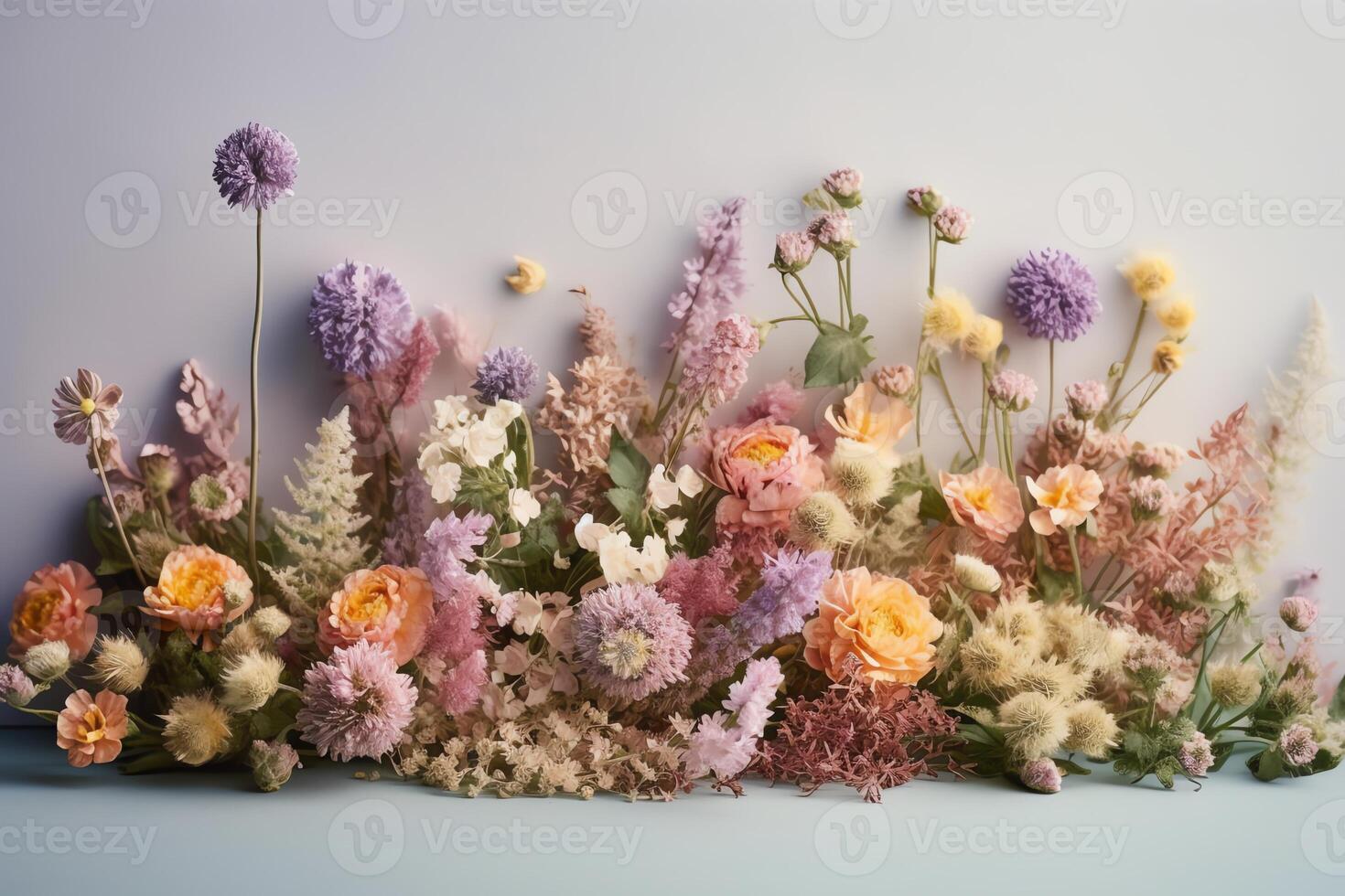 Creative flower composition with pastel spring field flowers. photo