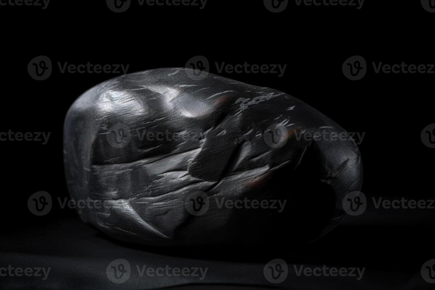 Paints is a rare gem natural geological stone on a black background in low key. . photo