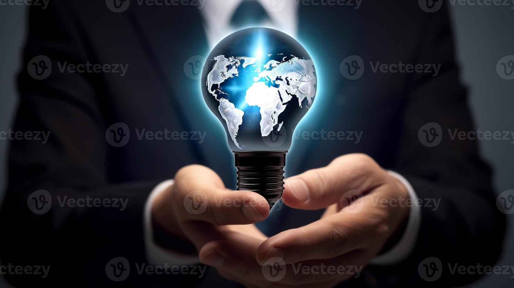 Businessman holding a glowing lightbulb in his hand. Business and innovation concept. photo