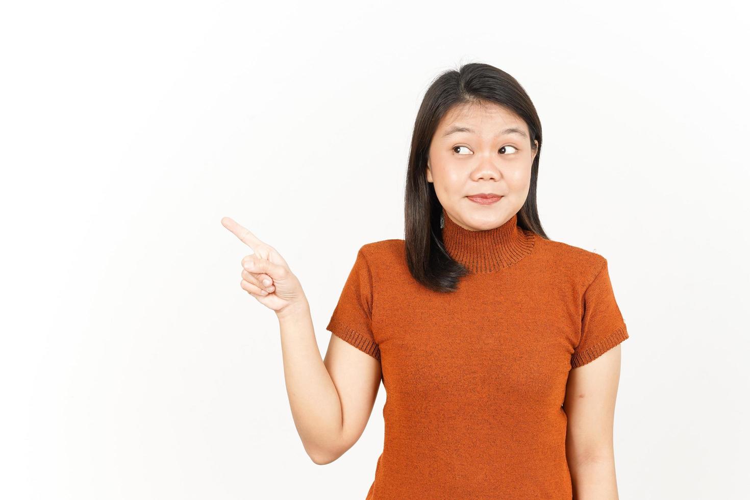 Showing Product and Pointing Side Of Beautiful Asian Woman Isolated On White Background photo