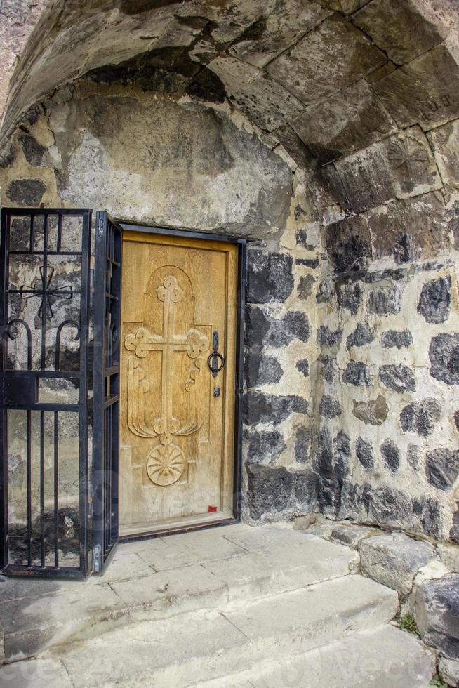 Gothic arched doorway concept photo. Monastery entrance, ancient stone architecture. High quality picture for wallpaper photo