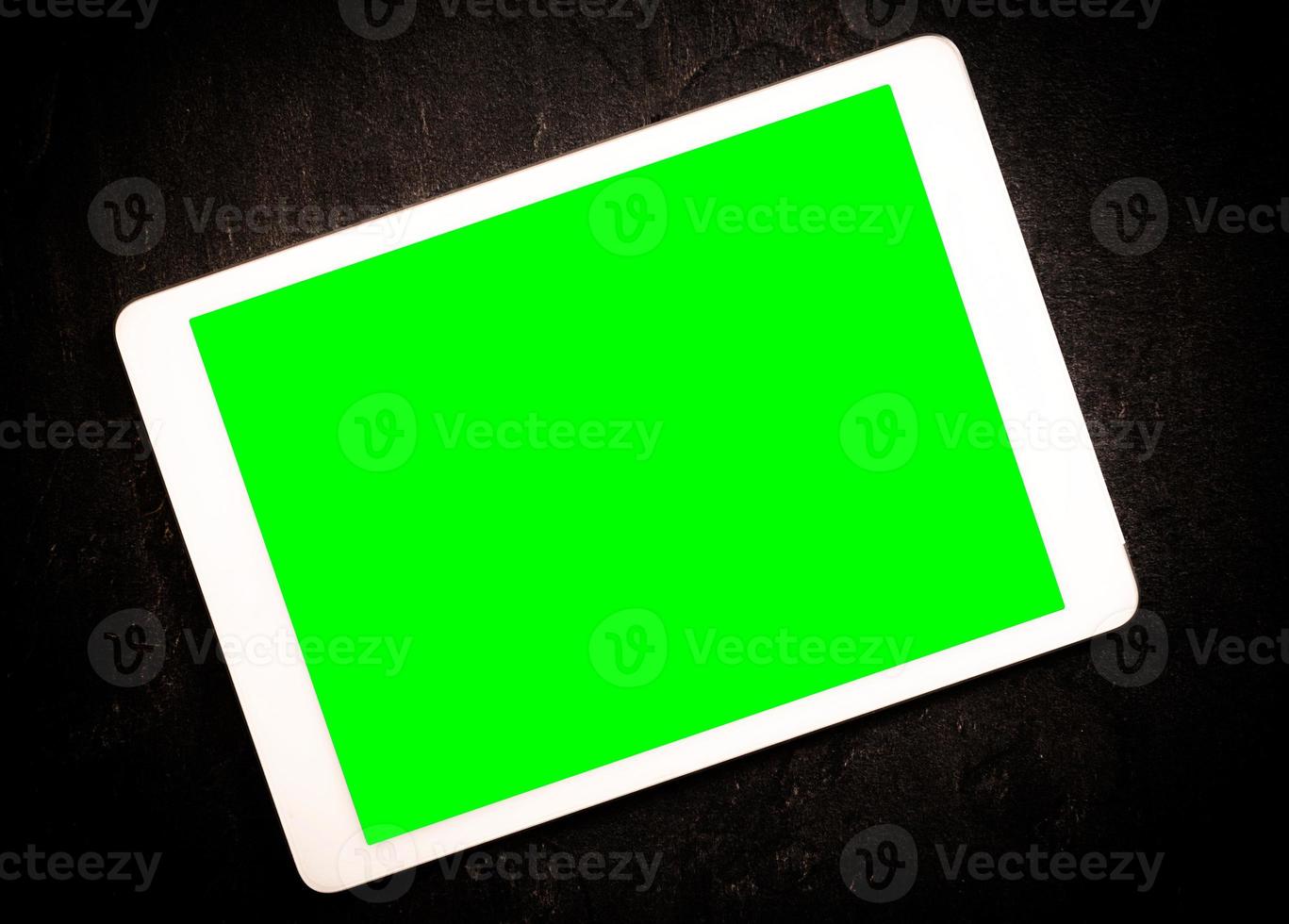 Tablet with green screen photo