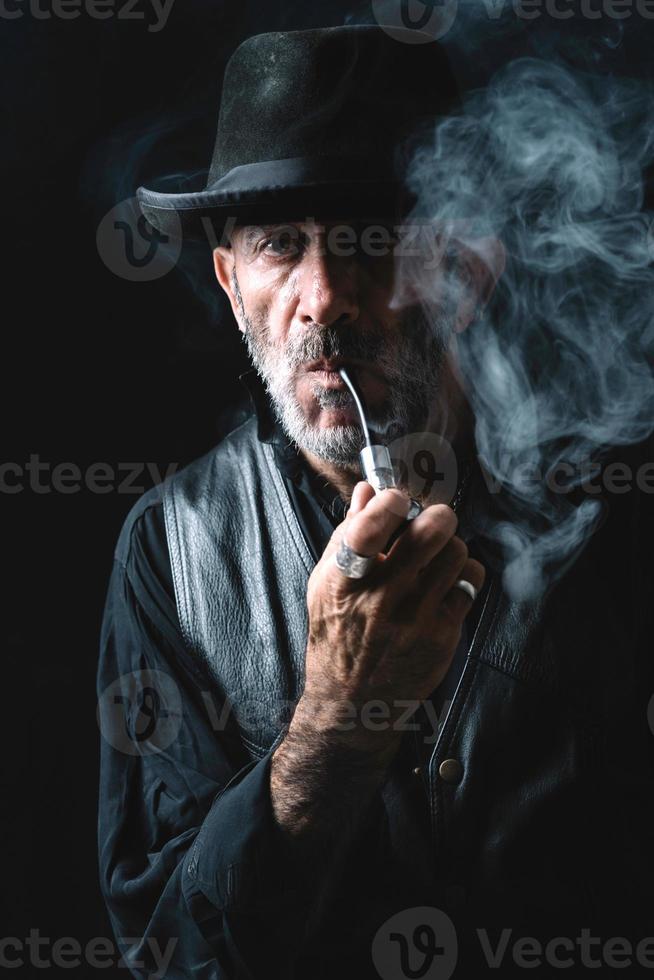 Smoking the pipe photo
