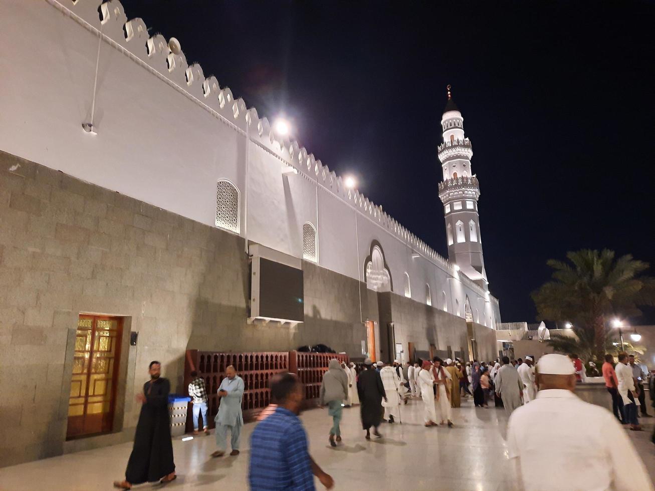 Medina, Saudi Arabia, April 2023 - A beautiful view of the building and minarets  of the Quba Mosque in Medina, Saudi Arabia at night. photo