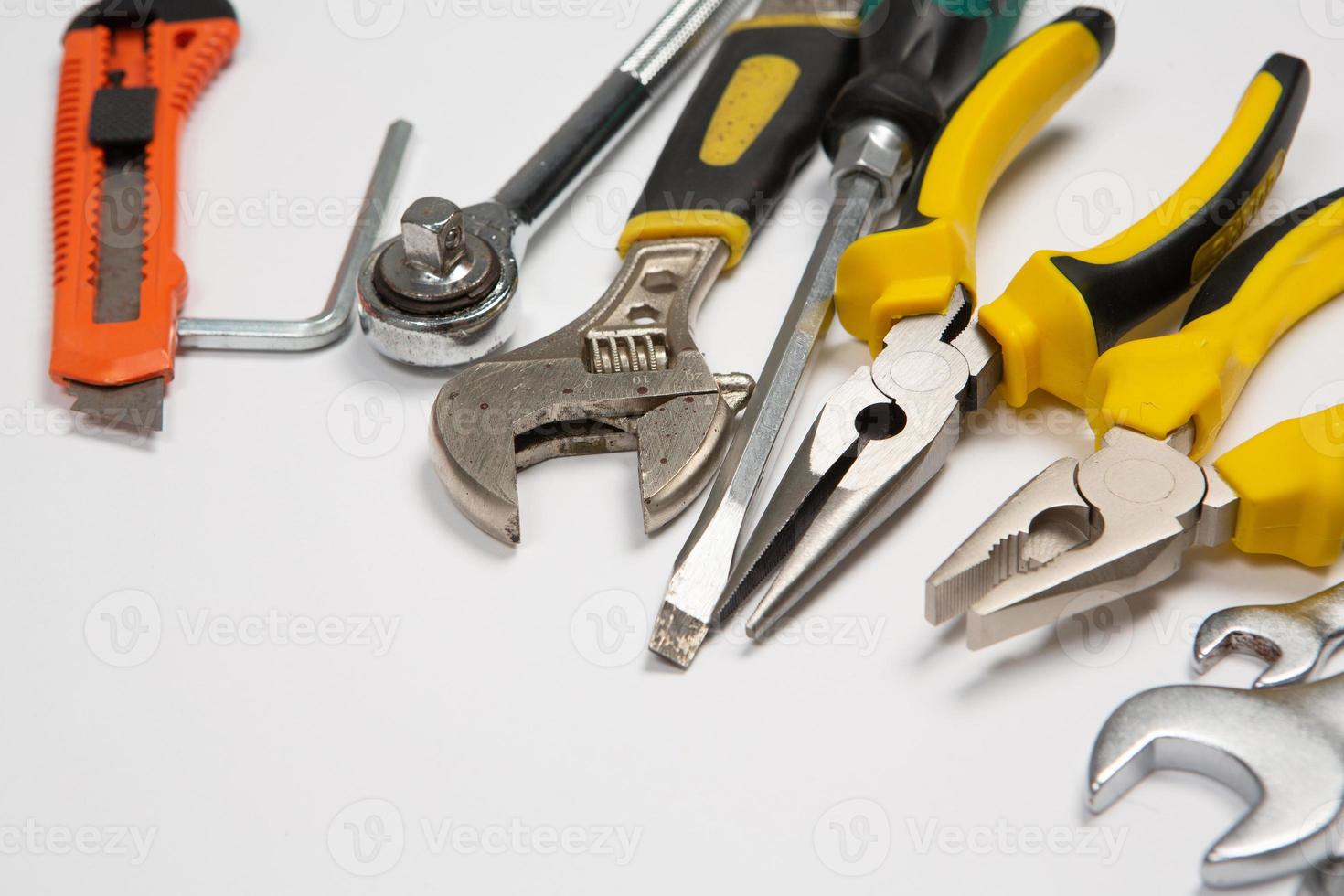 Set of tools for repair in a case on a white background. Assorted work or construction tools. Wrenches, Pliers, screwdriver. Top view photo