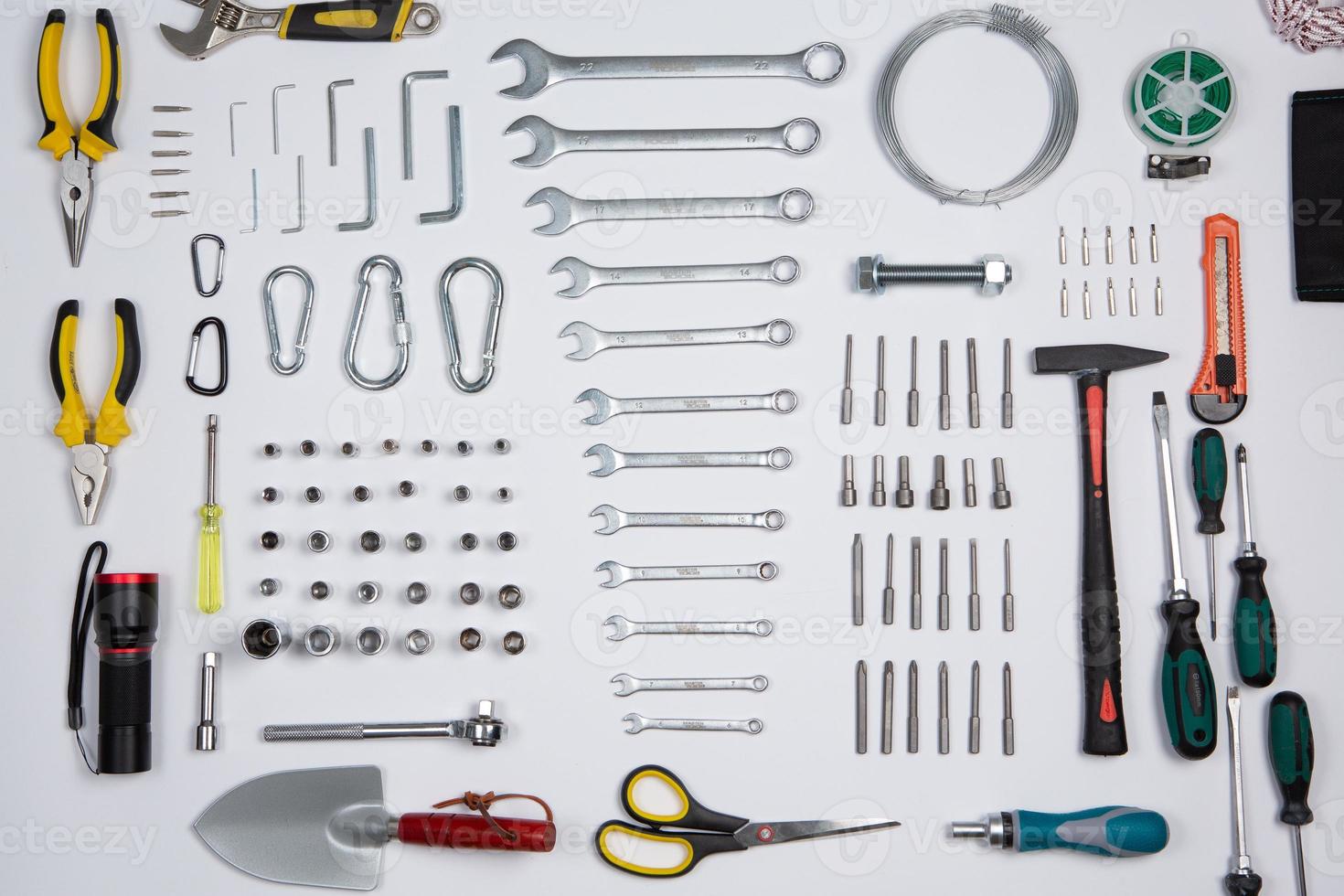 Set of tools for repair in a case on a white background. Assorted work or construction tools. Wrenches, Pliers, screwdriver. Top view photo