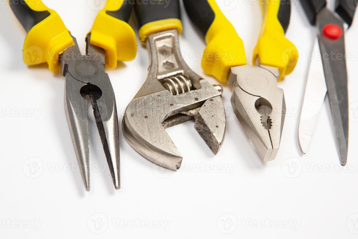 Set of tools for repair in a case on a white background. Assorted work or construction tools. Wrenches, Pliers, screwdriver. Top view photo