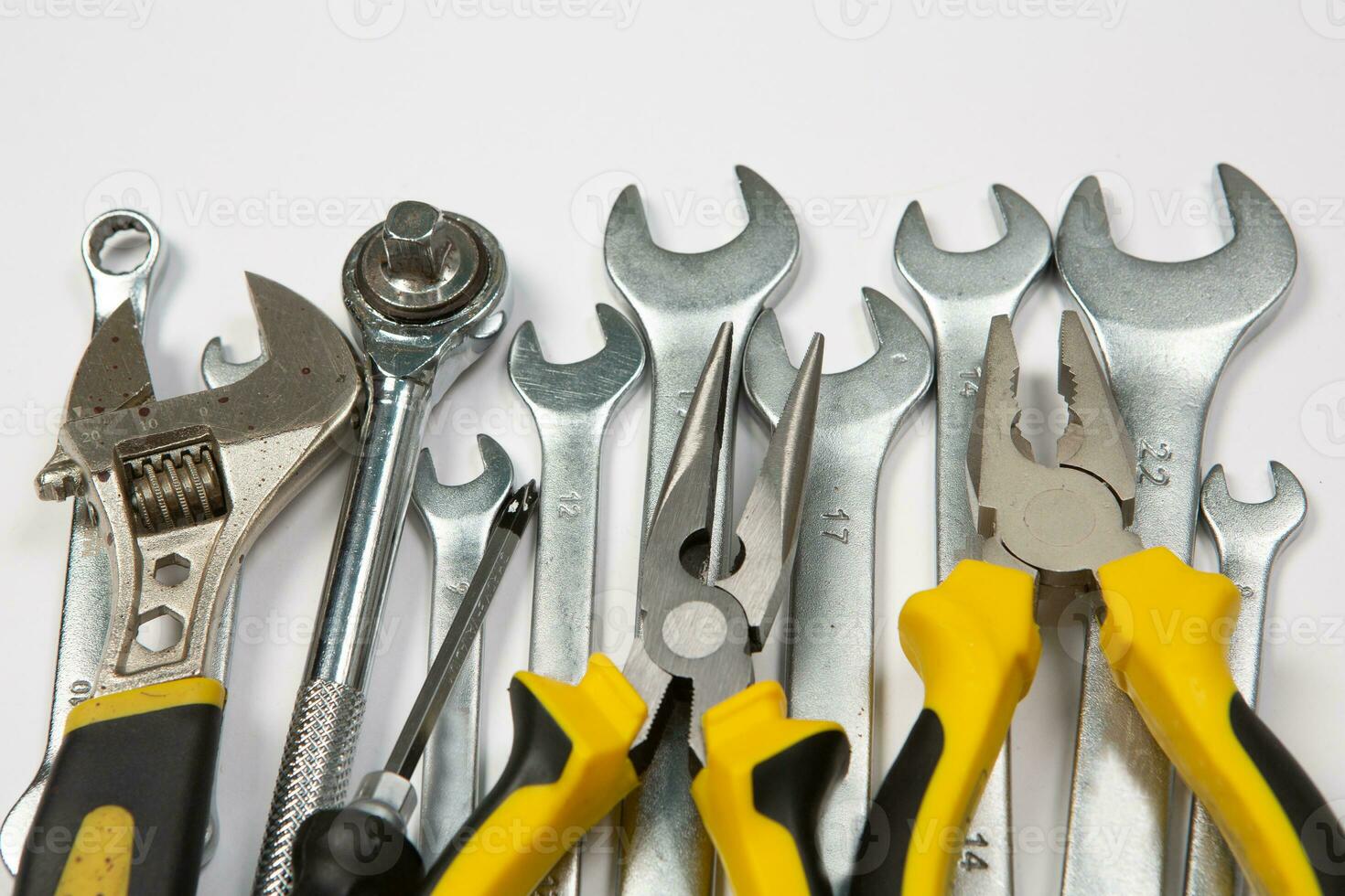 Set of tools for repair in a case on a white background. Assorted work or construction tools. Wrenches, Pliers, screwdriver. Top view photo