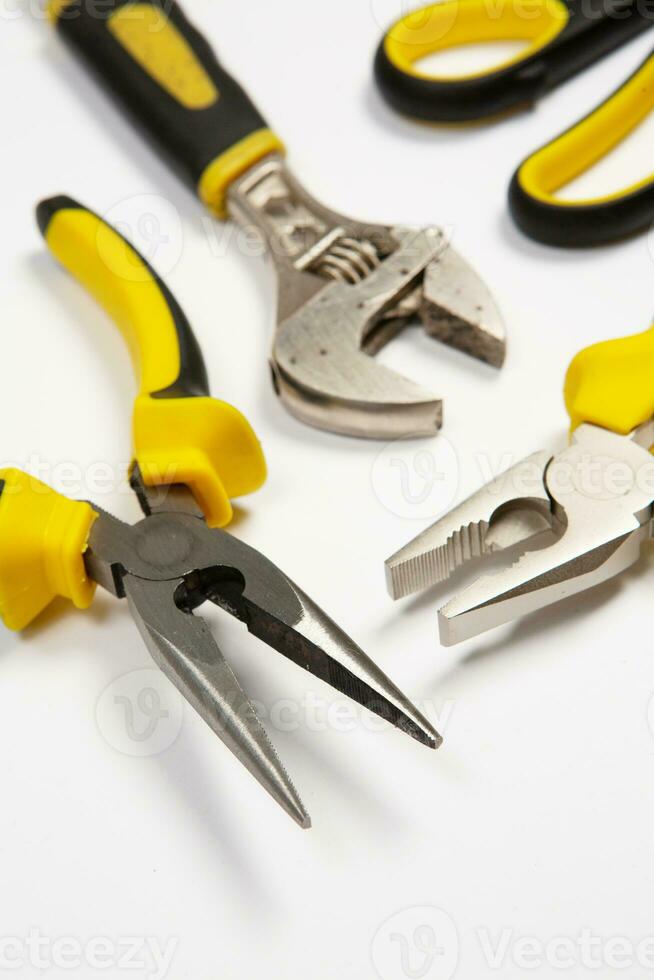 Set of tools for repair in a case on a white background. Assorted work or construction tools. Wrenches, Pliers, screwdriver. Top view photo
