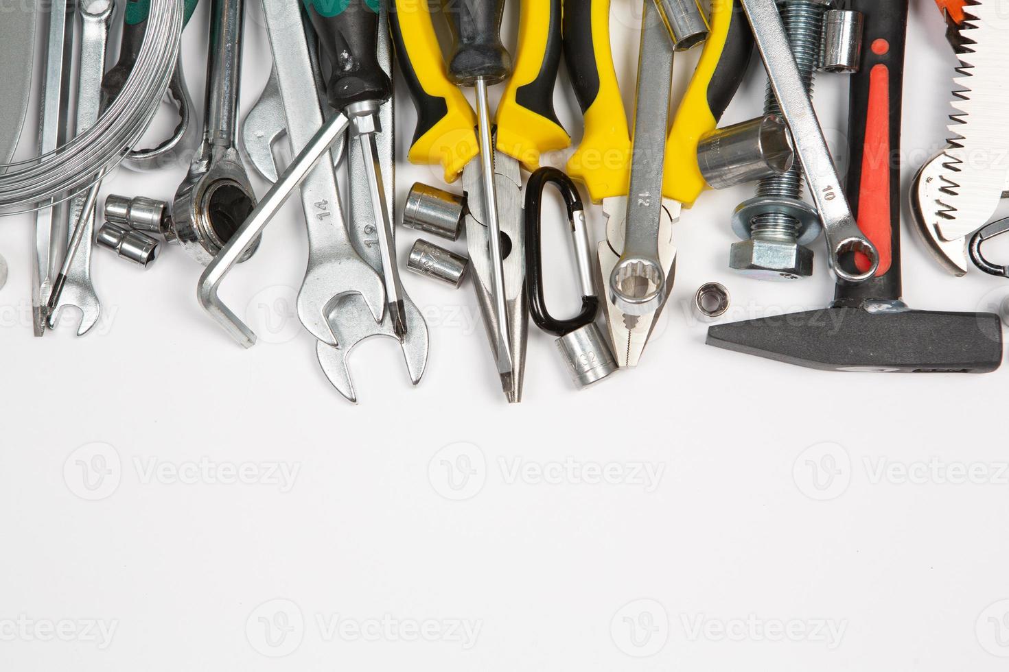 Set of tools for repair in a case on a white background. Assorted work or construction tools. Wrenches, Pliers, screwdriver. Top view photo