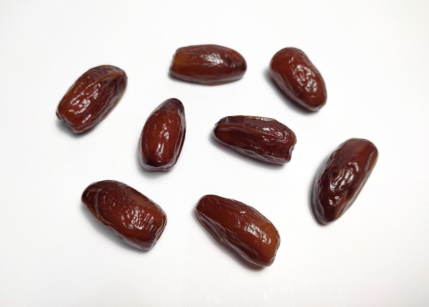 Close up of dried dates fruit isolated on white background photo