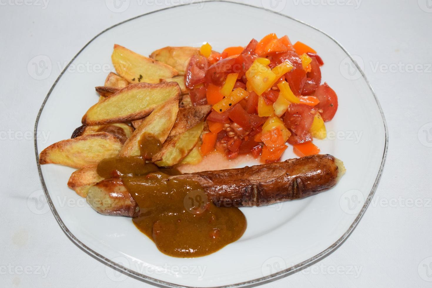 Crurry Saussage with Fires and Paprik Salad photo