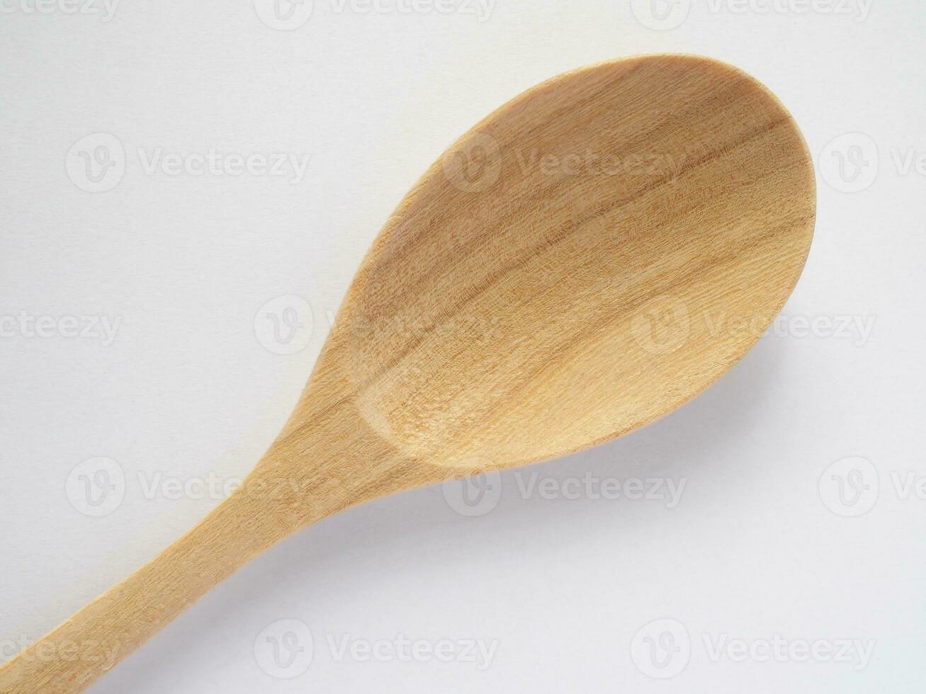 Parawood spoon on white background photo