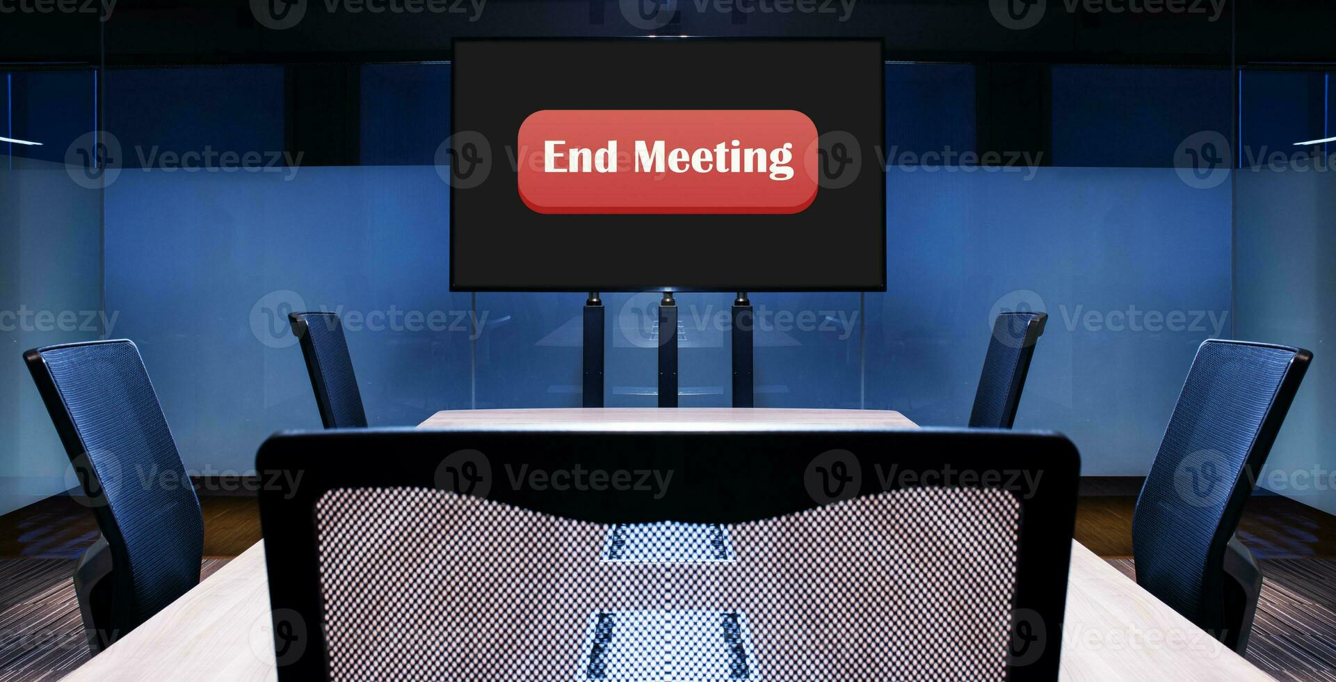 Television with red button message End Meeting on display in meeting room photo
