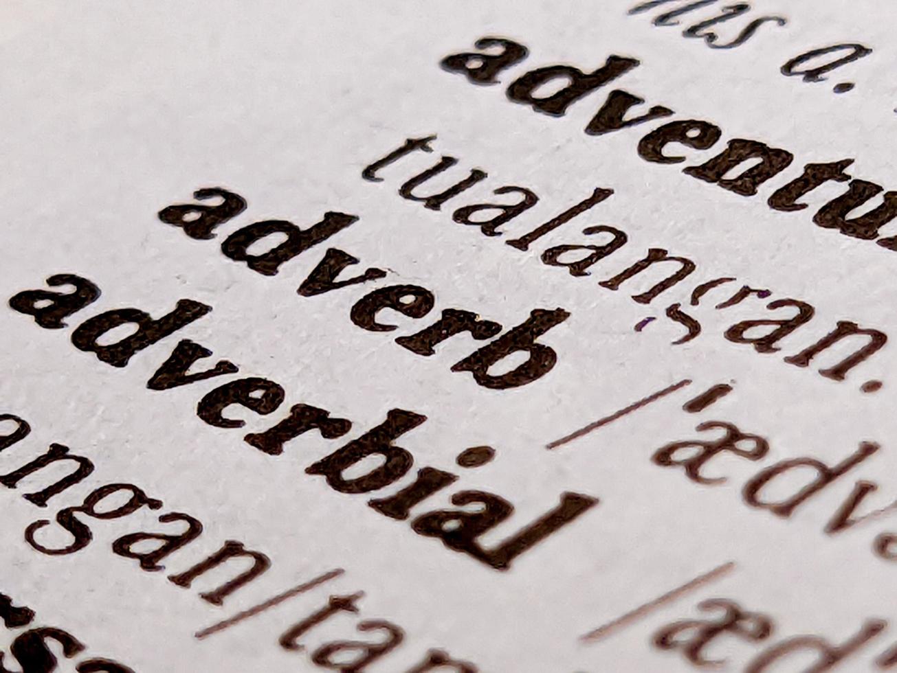 a close up of the word adverb in the English to Indonesian dictionary. For word background or wallpaper photo