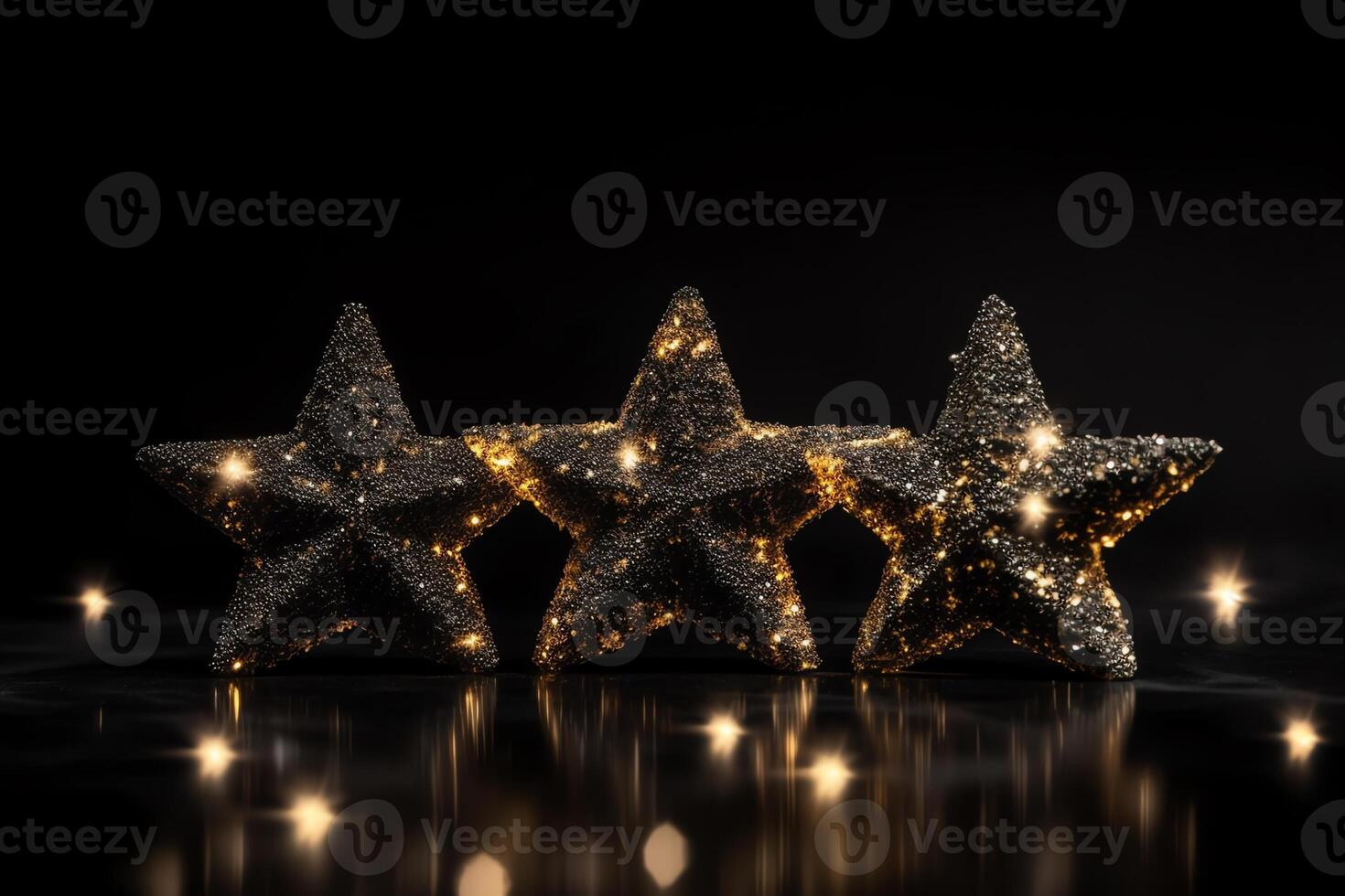 Three Gold Stars On Black Background With Sparkles. Christmas Eve. photo