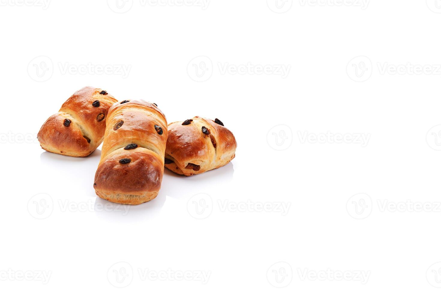 a group of buns with raisin toppings isolated on solid white background with copy space. photo