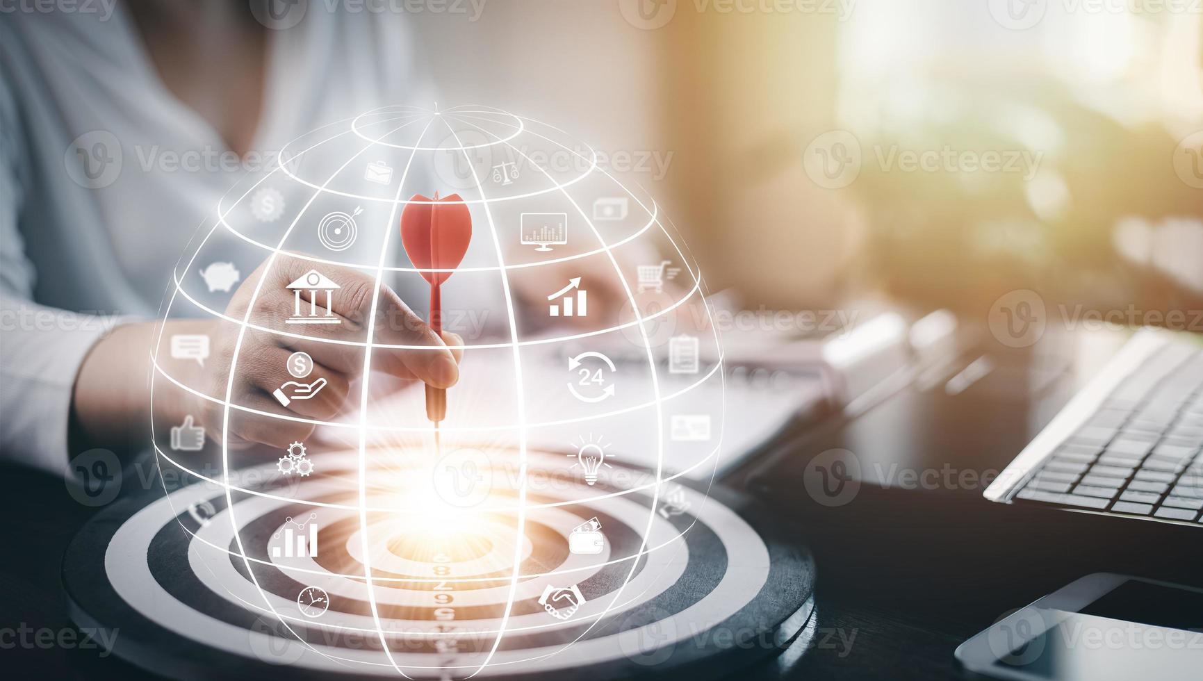 Targeting with marketing business concept, Businesswoman hand holding red dart to the virtual target dartboard, Executive marketing, investment goal and target for business investment concept, photo