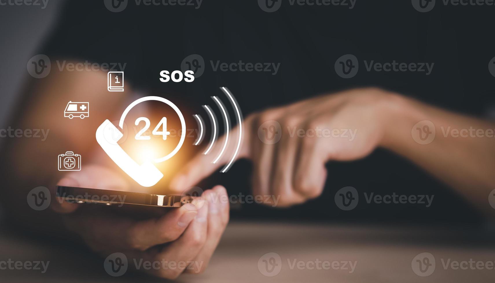 Hand touch button Emergency app in home, call phone, Chat message icon, Emergency application from smartphone for elderly, technology concept.Old hand touch mobile phone and call for help. photo