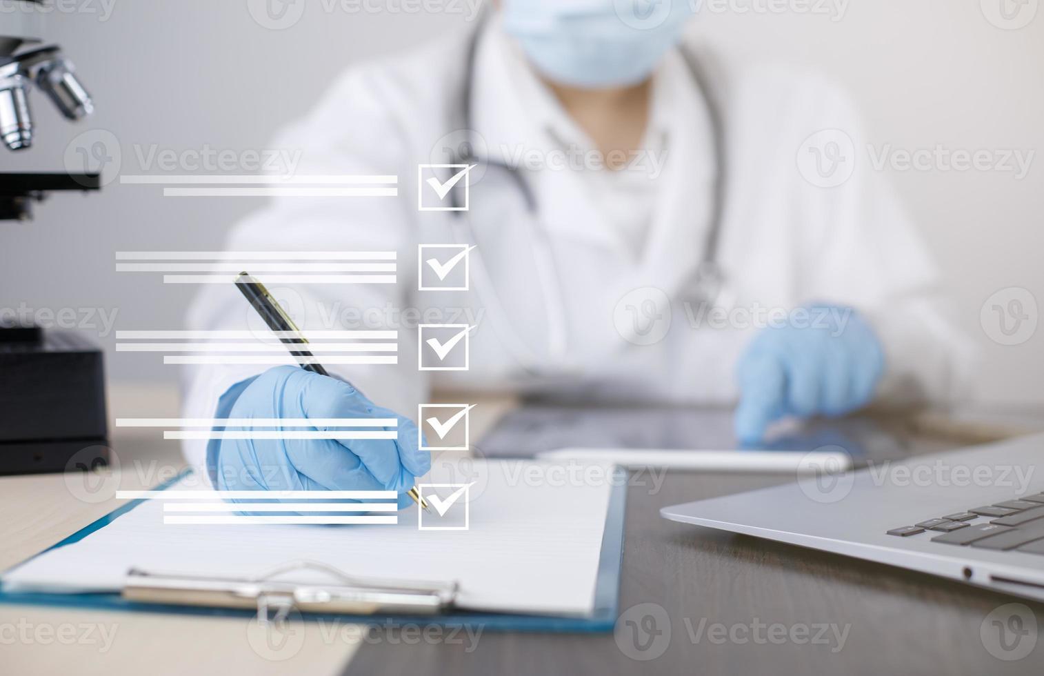 Female Doctor using Taking an assessment, questionnaire, evaluation, online survey, Prescription or signing medical report or medical certificate or health check-up form documents in hospitals. photo
