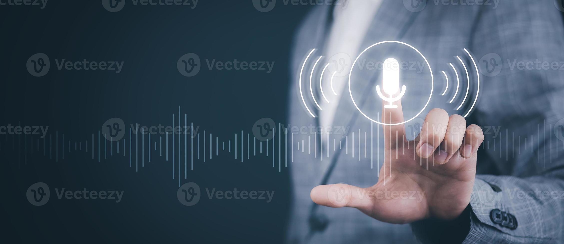 Business people Hand touch the microphone button on virtual screen. Blog speak talk advertising presentation, Voice recognition, speech detection and deep learning application, Voice Assistance photo