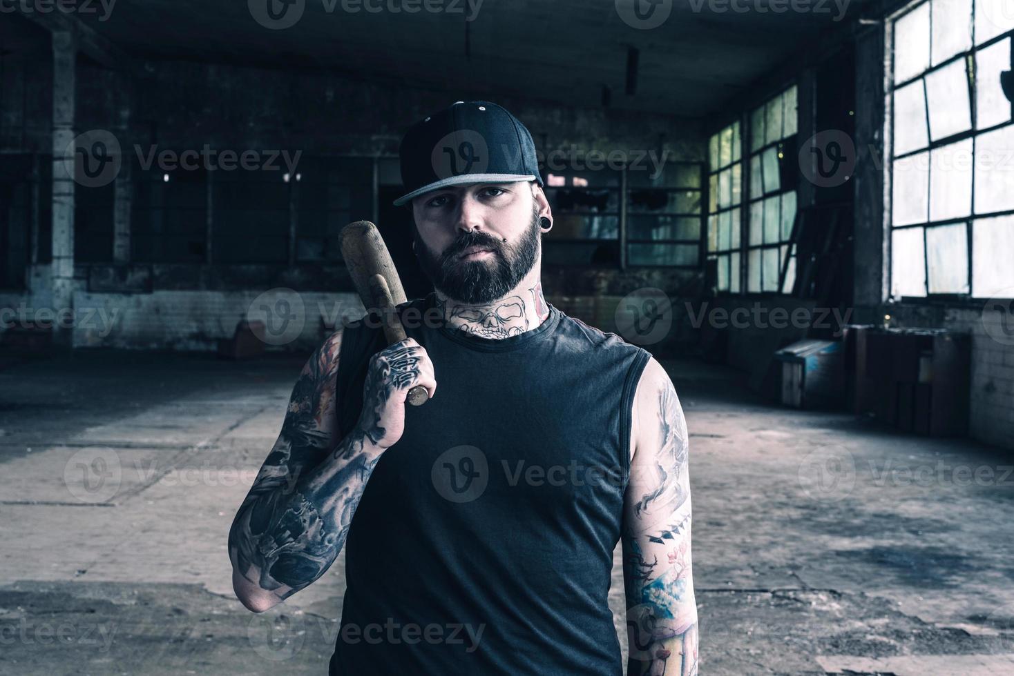 Tattooed man with the hammer photo