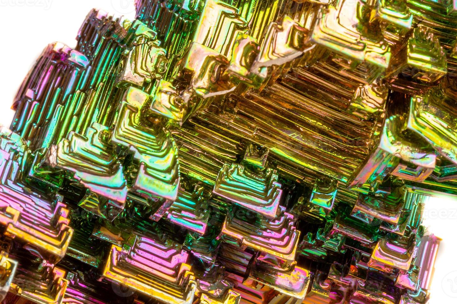 Macro of the mineral bismuth stone on a white background photo