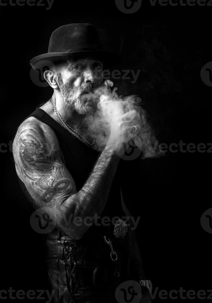 Smoking man portrait in monochrome photo